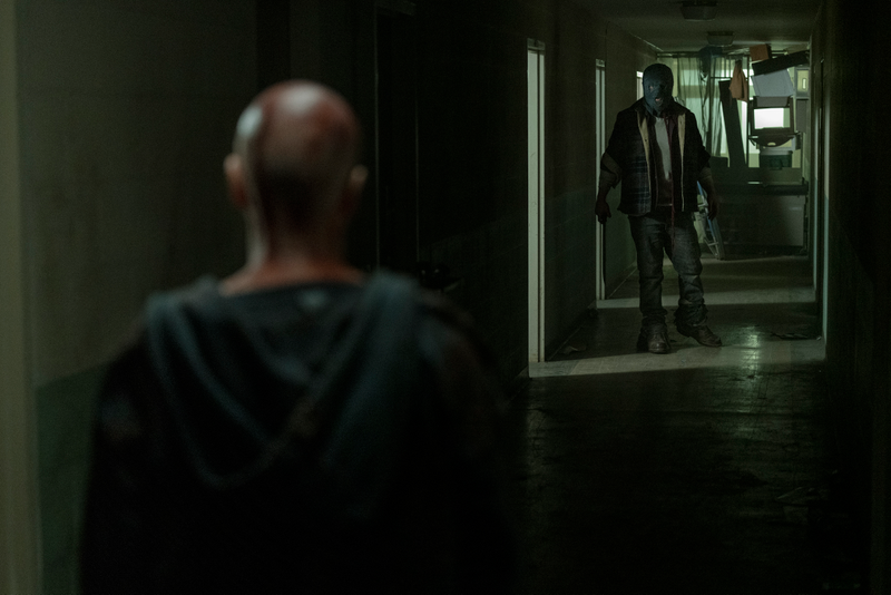Out of the zombie apocalypse, into the sanitarium with the machete-wielding masked man.